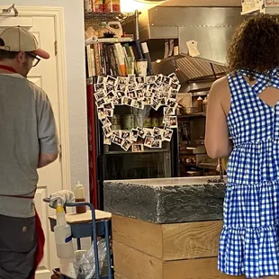 a man and a woman in a kitchen