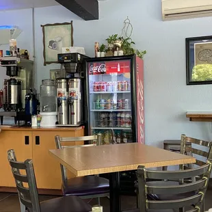 a woman standing in a coffee shop