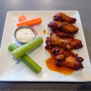 The Wings - smoked or fried, choice of 3 badass sauces or dry rub