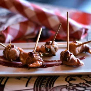 &quot;Holla&quot; Pena&apos; Lollipoppas- Tiger Prawns stuffed with Serrano Pepper and Cream Cheese. Wrapped in Bacon served w/ Raspberry Jalapeno Jam