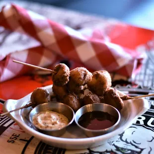 Poodle Bites - House Smoked Polidori Andouille Sausage dunked in Jalapeno Cheddar Waffle Batter and Deep Fried