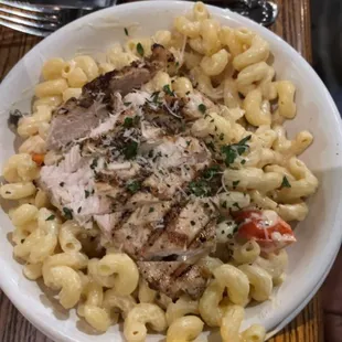 a plate of pasta and meat