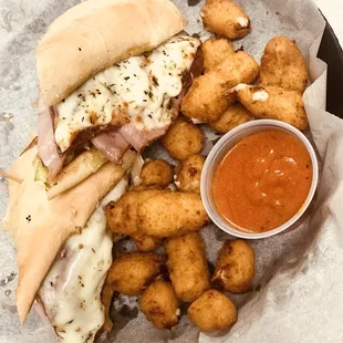 a sandwich and tater tots