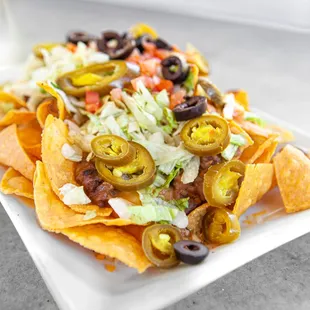 a plate of nachos on a table