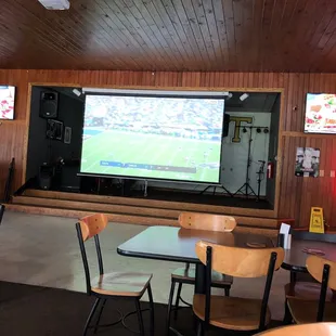big screen with game on Sunday