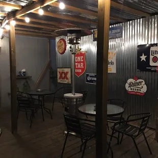 a man standing in a room with tables and chairs