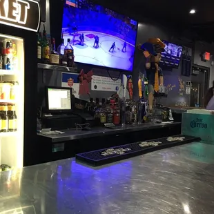 a sports bar with a large screen tv