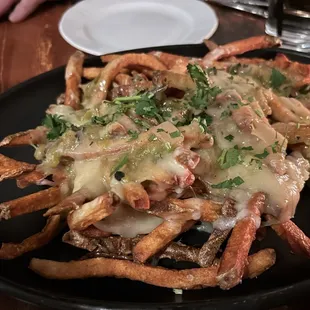 Green chili cheese fries. Crispy fries...lots of cheese...