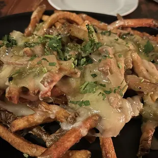 Green chili cheese fries were loaded w cheese and sauce.