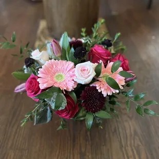 Floral arrangement Gerber daisy, roses, tulips, cremon and mixed greens