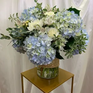Blue hydrangea bouquet roses hypericum berry and mixed greens