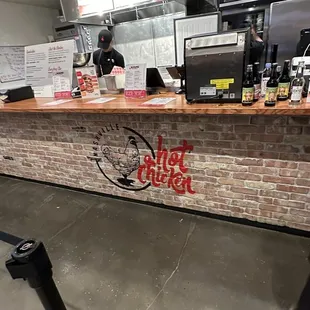 a brick bar with graffiti on it