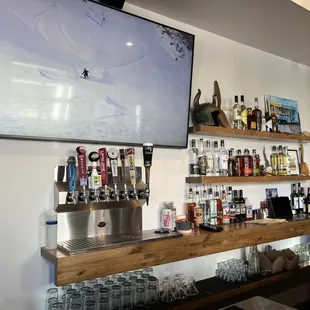 a bar with a large television above it