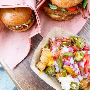 Loaded tots, chicken blt sandwich and burger with slaw