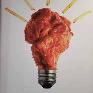 a lightbulb with fries sticking out of it