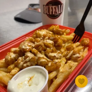 the world famous buffalo fries mango habanero flavor with blue cheese