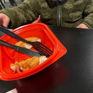 Baby eating food George brought