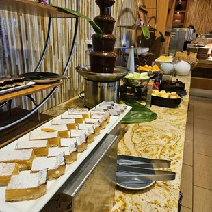 Variety of desserts, chocolate fondue, and ice cream machine