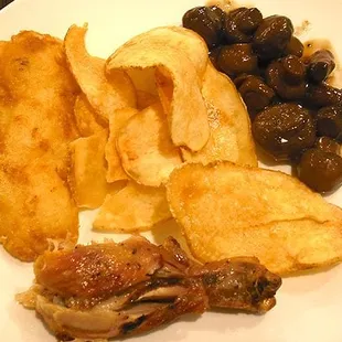 A sampler dish assembled from the buffet: fish, freshly-cooked chips, roast chicken, burgundy mushrooms.
