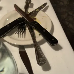 Used utensils sat on our table the entire meal.
