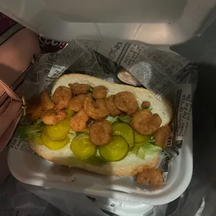 a hot dog with pickles and pickles