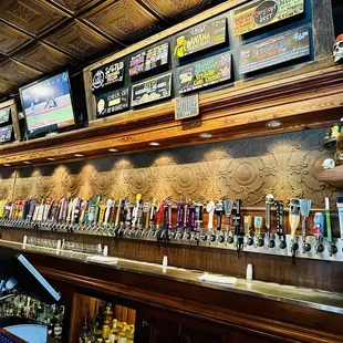 a row of beer taps in a bar