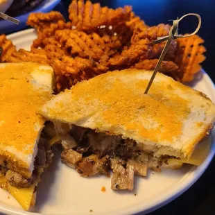 a plate with a sandwich and fries