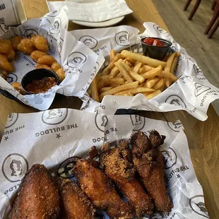 a basket of fried chicken and french fries