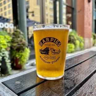 a pint of beer on a table