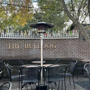a patio with tables and chairs