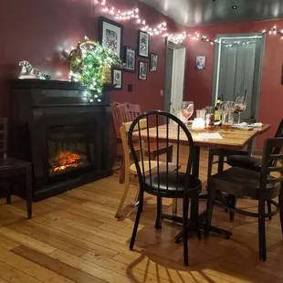 Fire place and one of the dinning areas.