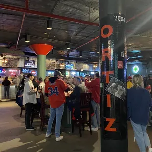 a large group of people at a bar