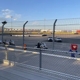 Motorcycle Police leading the First Responders around the track.