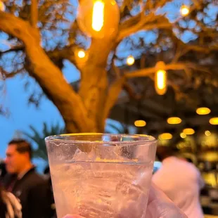 a person holding a drink