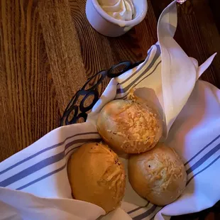 three rolls of bread in a basket