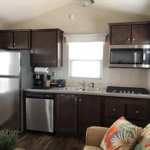 Each kitchen comes equipped with a full-size refrigerator, stove-top oven, microwave and dishwasher.