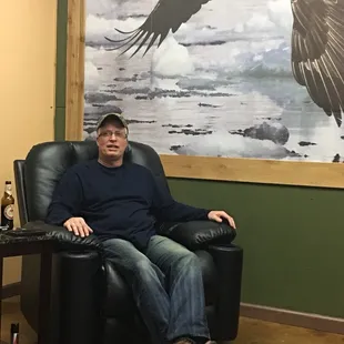 a man sitting in a leather chair