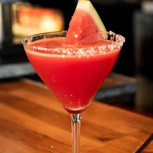 a watermelon cocktail in a martini glass