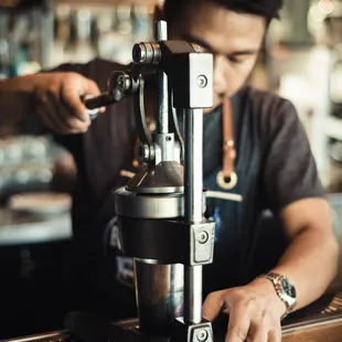 a man using a coffee machine