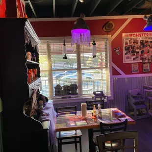 a dining area with tables and chairs