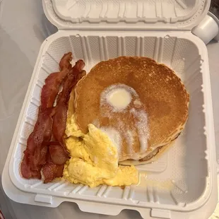 Pancakes with scrambled eggs and bacon