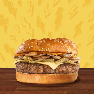 a hamburger with cheese and onions