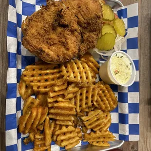 Fried chicken sandwich and waffle fries with house made garlic parmesan sauce