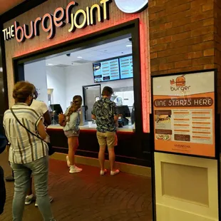 people standing in line at the counter