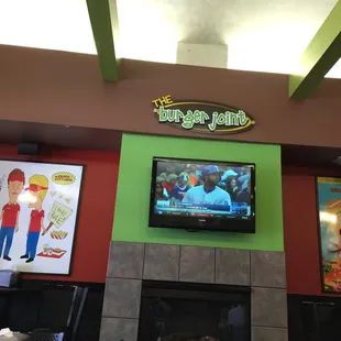 a television above a fireplace