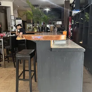 A bar but no bartender and one guy walked in and sat for 5 minutes before leaving