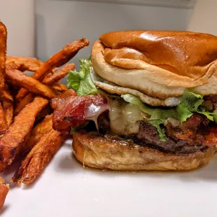 Pineapple bacon burger (with added fried egg and avocado) and sweet potato fries - both must-haves!