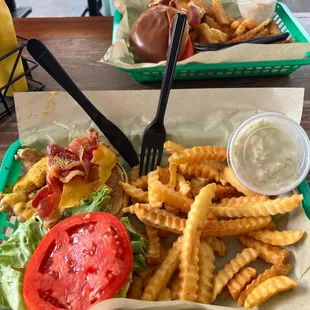 a basket of fries and a salad