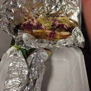 Zombie dog with a still-wrapped Fun Guy pita.