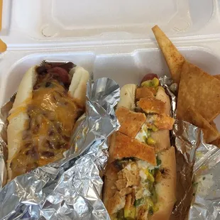 Pappy (bacon wrapped, chili/cheese) and Pedro (corn mango salsa/torts) hot dogs